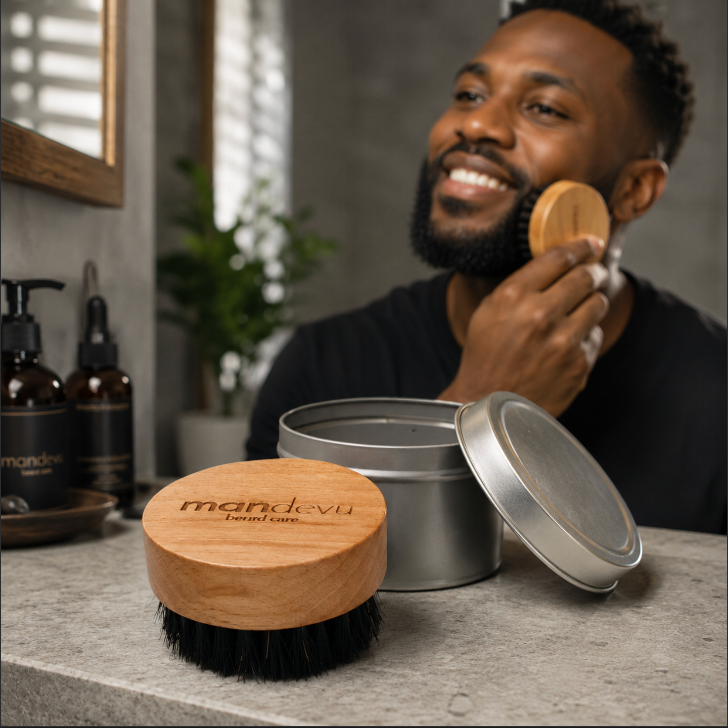 Man applying beard product with mandevu branded items on a table.