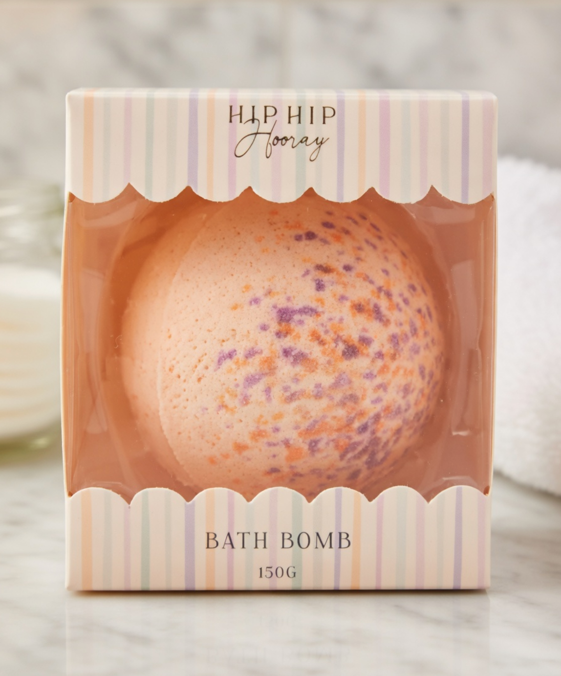 Bath bomb in a decorative box with 'Hip Hip Hooray' text on a neutral background