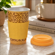 Ceramic coffee travel mug with grip and lid