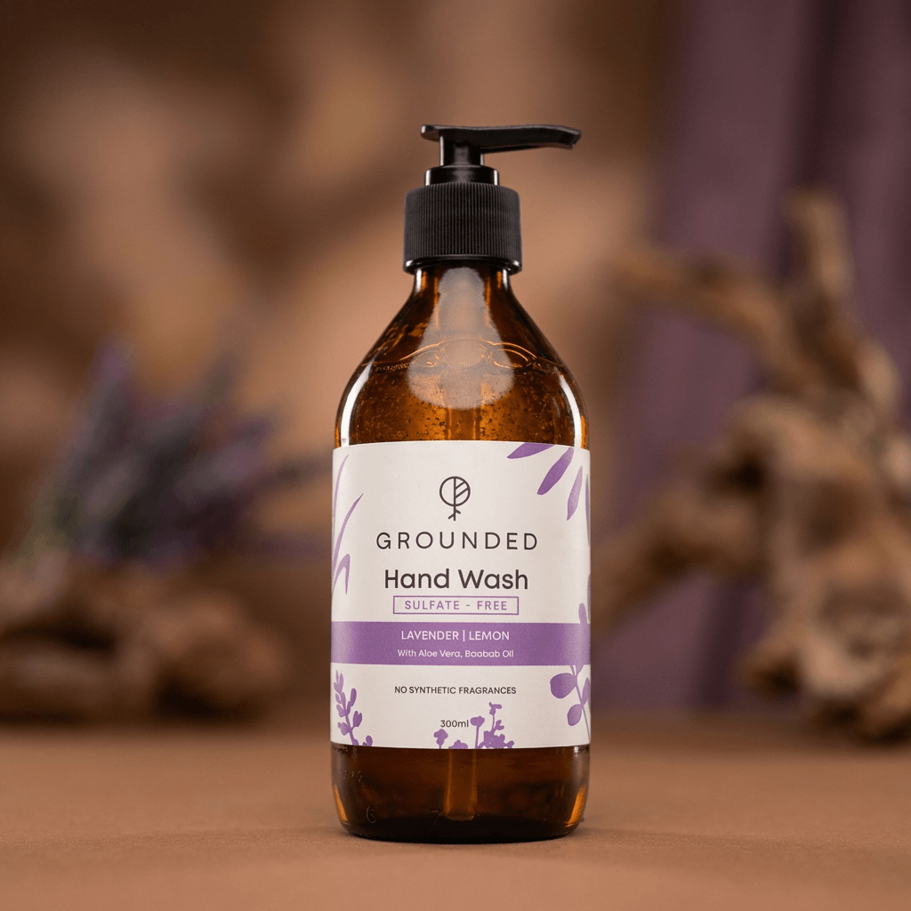 Brown bottle of Grounded Lavender Lemon hand wash with a blurred natural background
