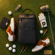 Golf bag with golf shoes, balls, club, glove, and accessories on a grassy background