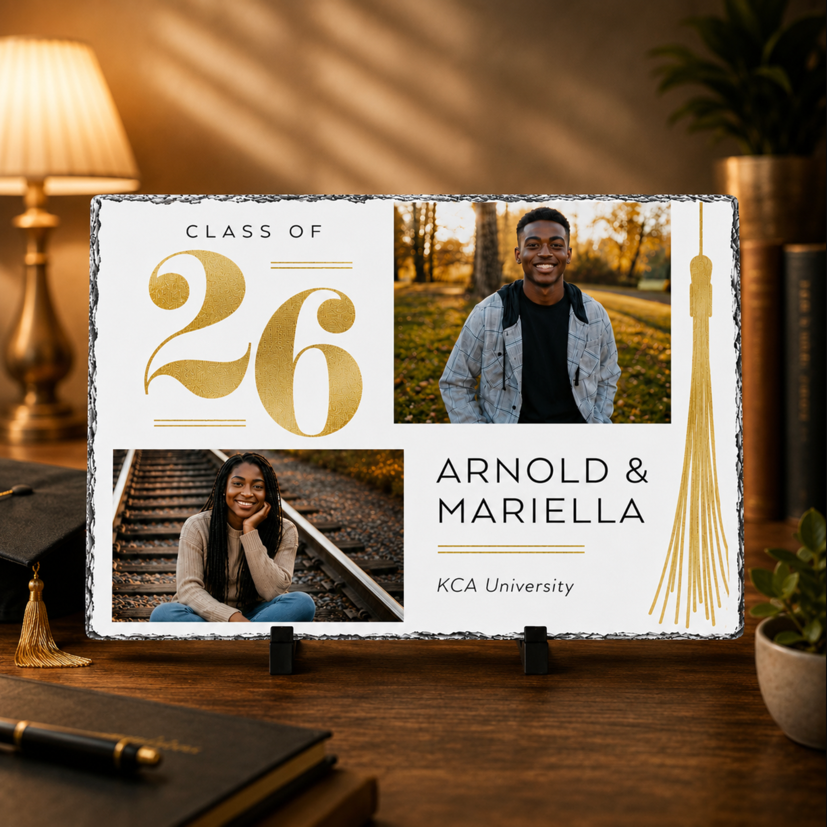 Graduation-themed decorative sign with photos of two people and 'Class of 2026' text on a wooden surface.