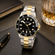 Sekonda watch with silver and gold band on a dark surface with a glass of whiskey and pen.