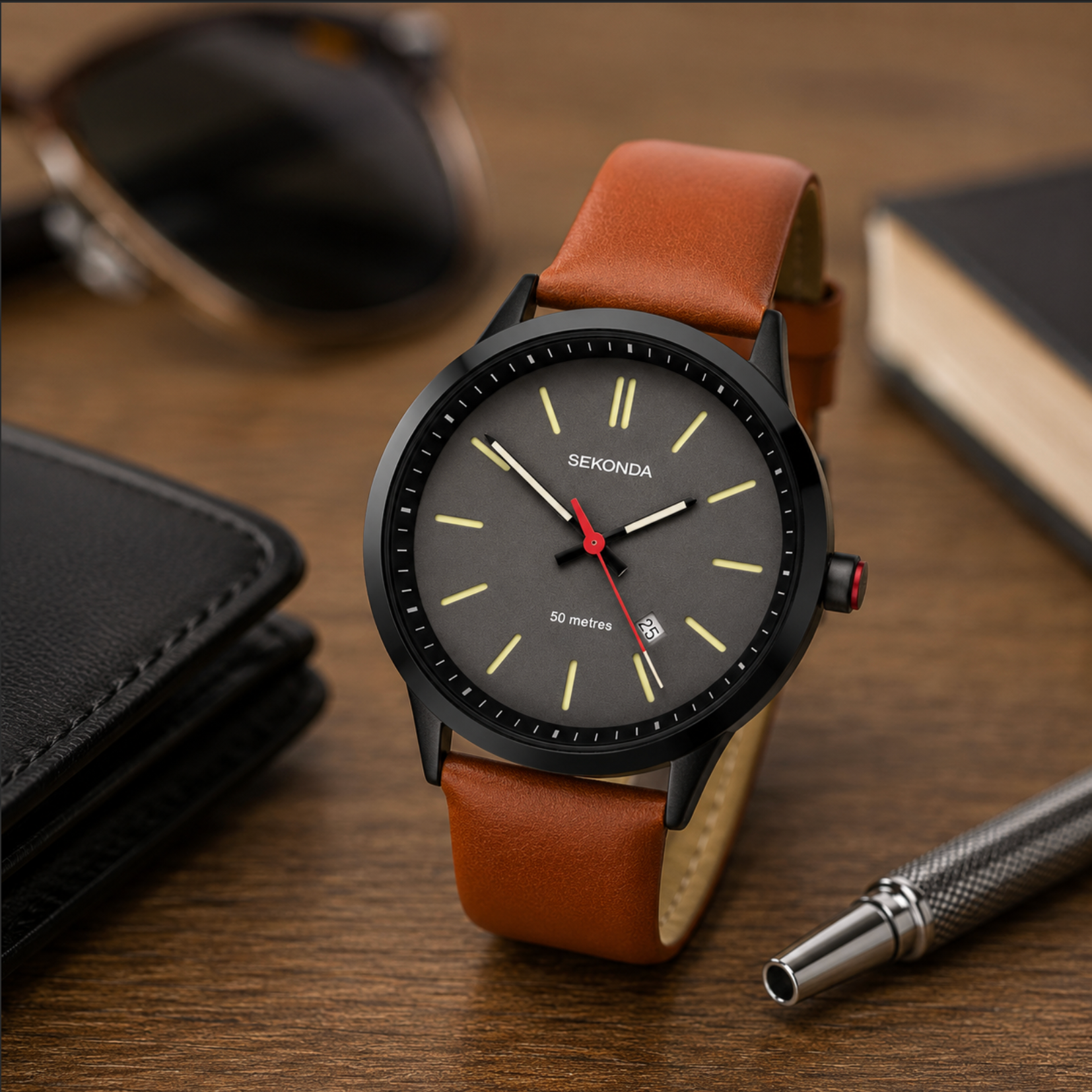 Sekonda watch with brown leather strap on a wooden surface with wallet and pen.