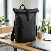 Black backpack with Suntech Consulting logo on a desk in an office setting
