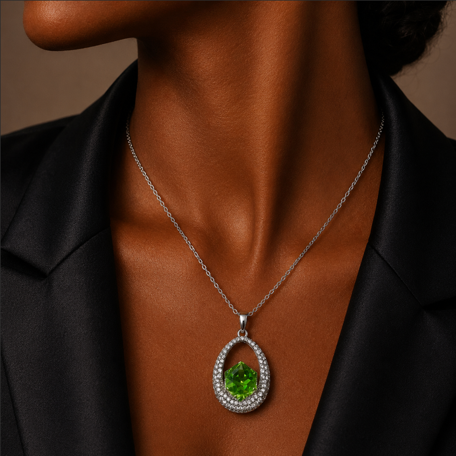 Green gemstone necklace on a person wearing a black shirt