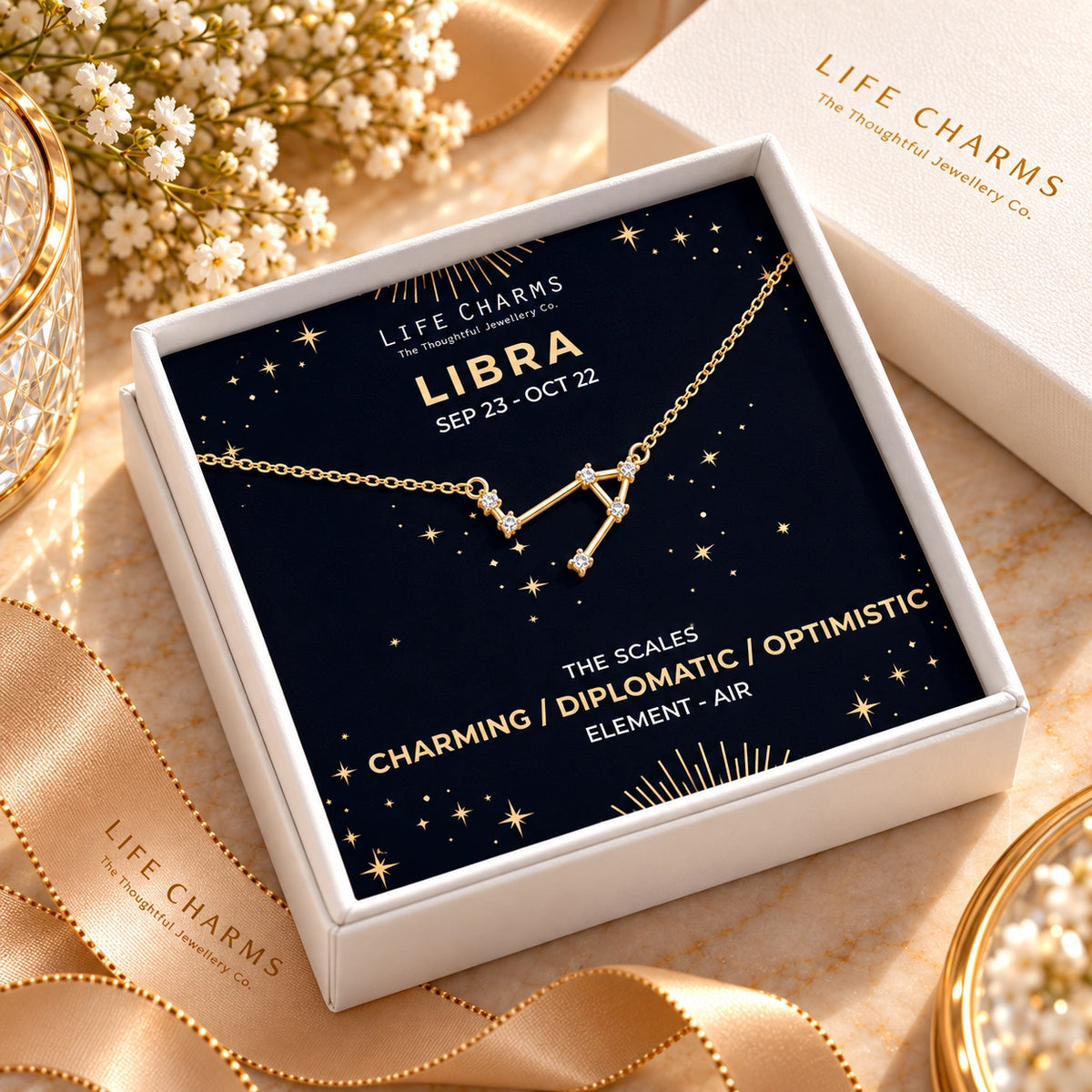 Gold constellation necklace in a white gift box